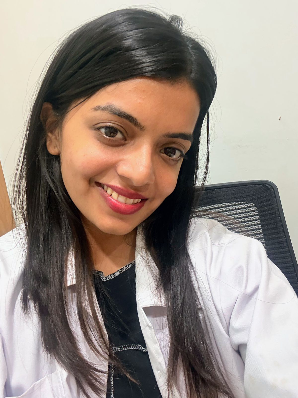 Mrunal Kudalkar in a lab coat